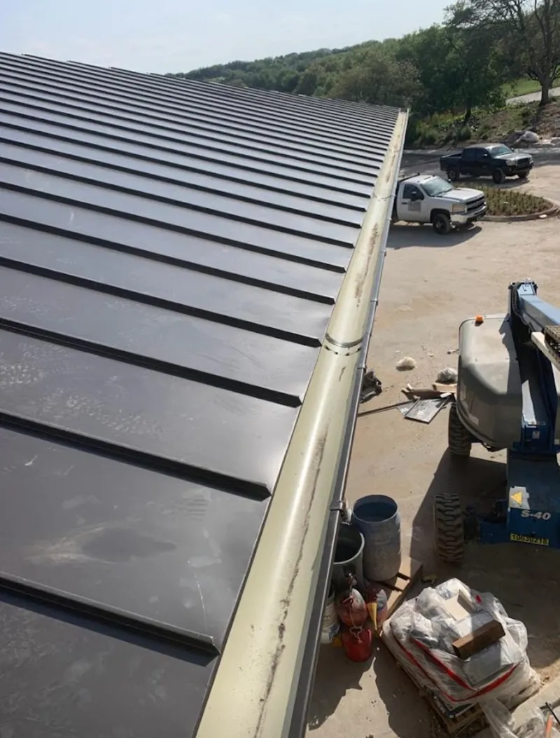 Standing seam panel and gutter detail on a metal roofing jobsite in Calcutta